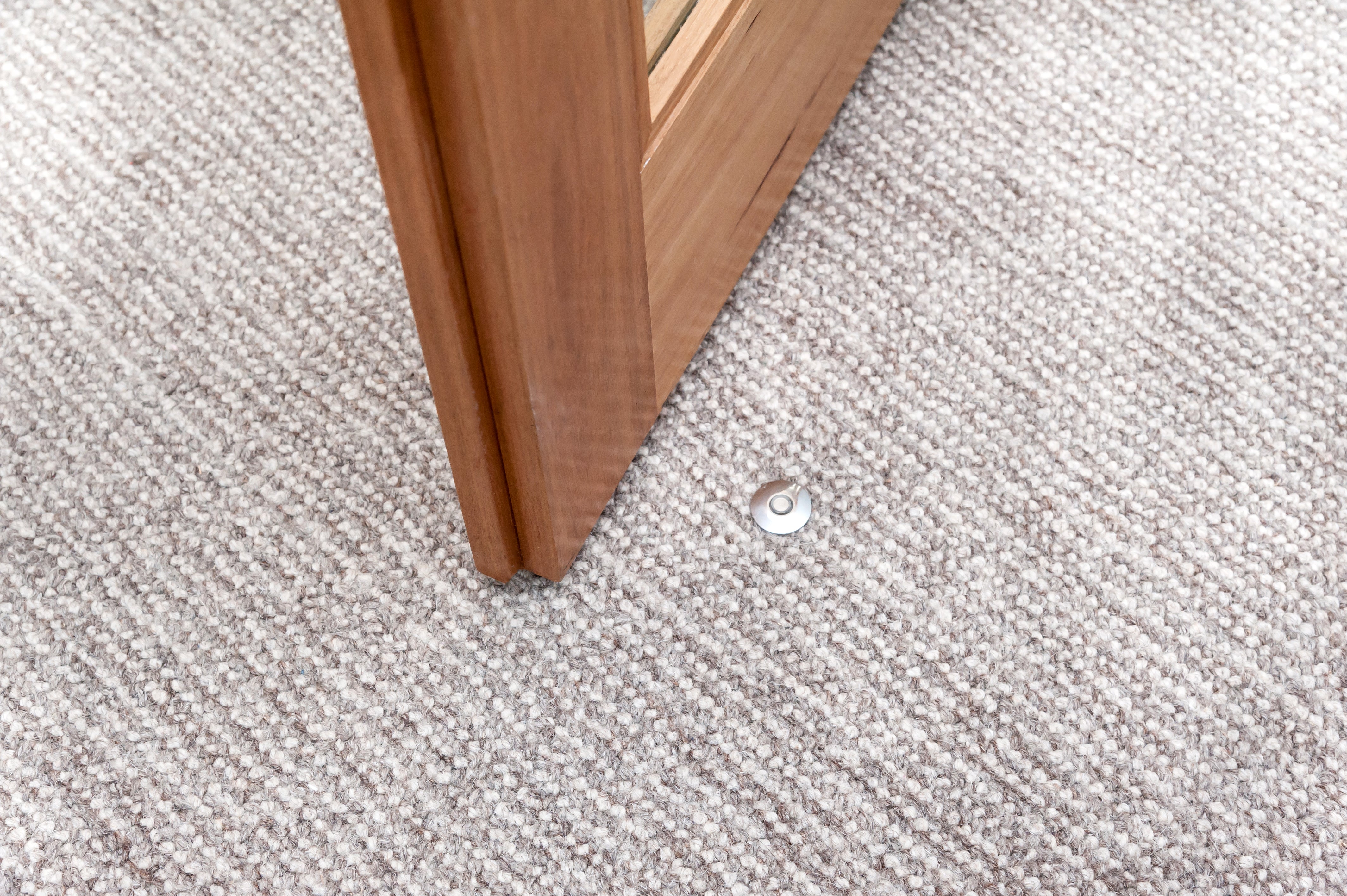 Fantom Doorstop on carpet