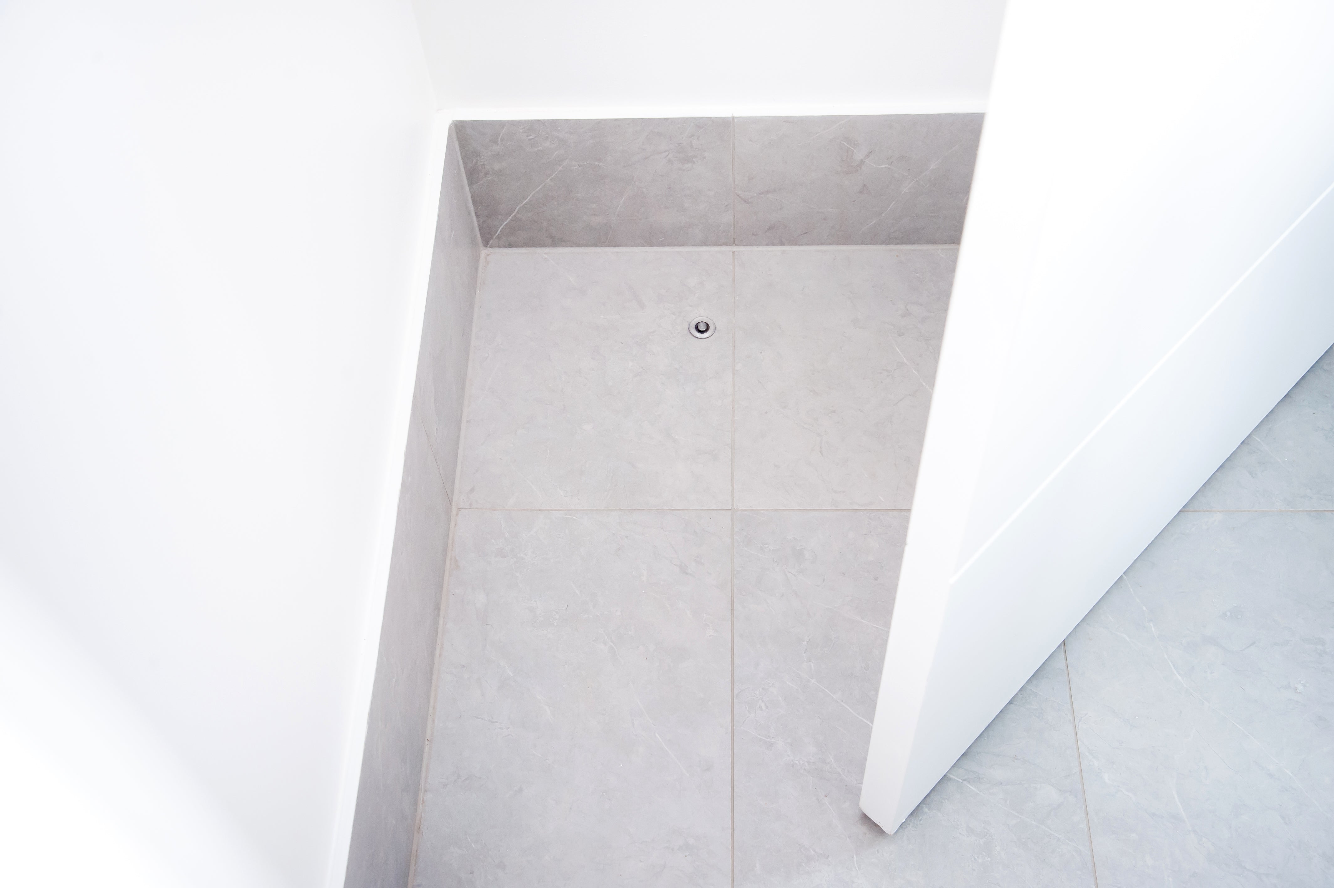 Fantom Doorstop on tiles